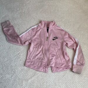 Size 5-6 pink Nike jacket w zipper and pockets.